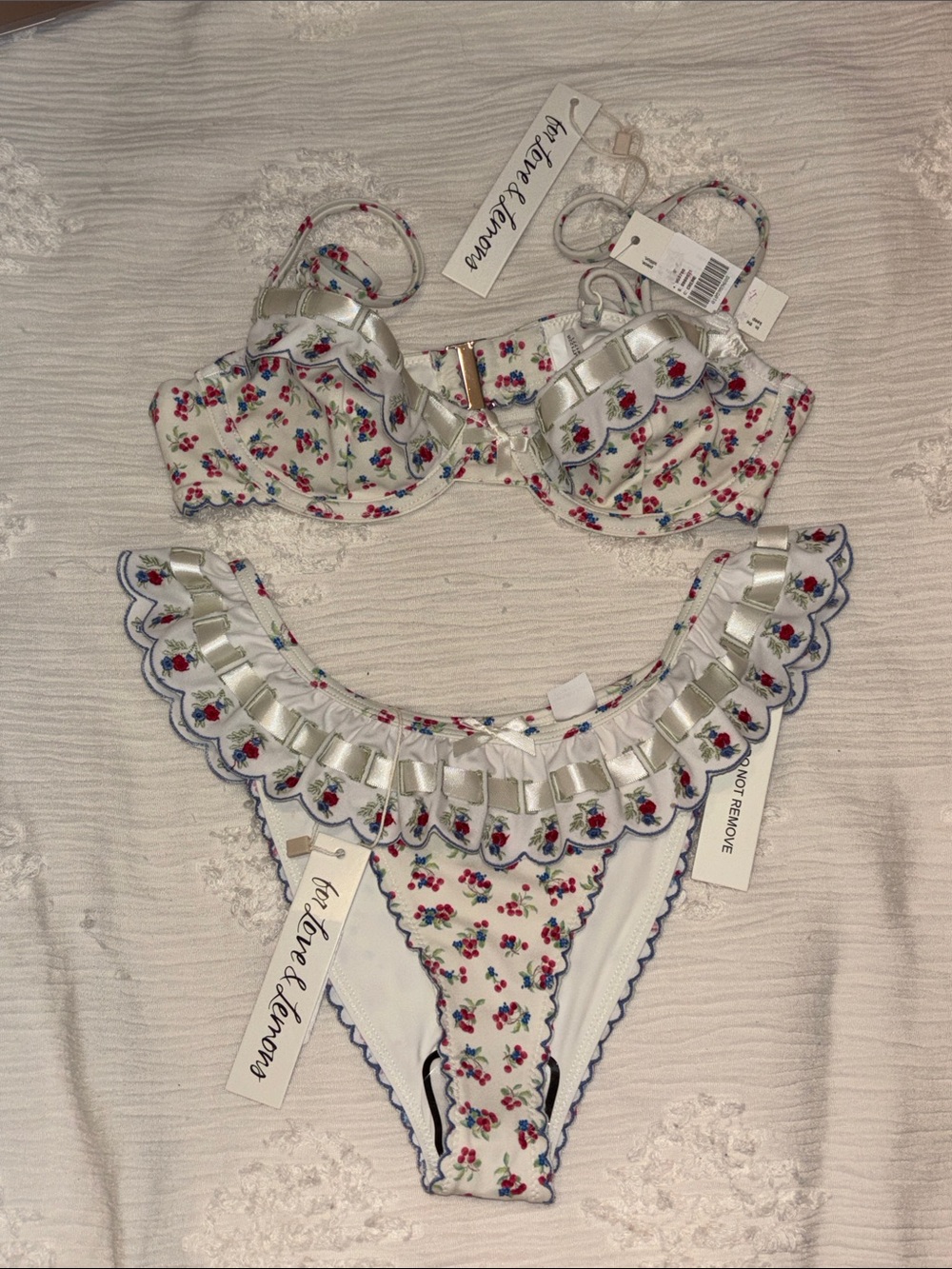 For Love And Lemons White Floral Ruffle Bikini with Red and Blue Accents